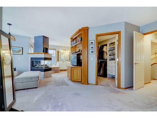 63 Woodpark Close Sw, Calgary, AB - Indoor With Fireplace