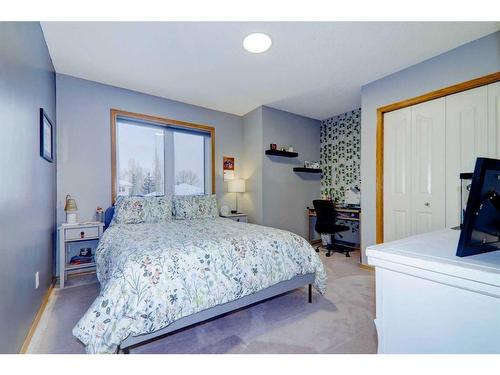 63 Woodpark Close Sw, Calgary, AB - Indoor Photo Showing Bedroom