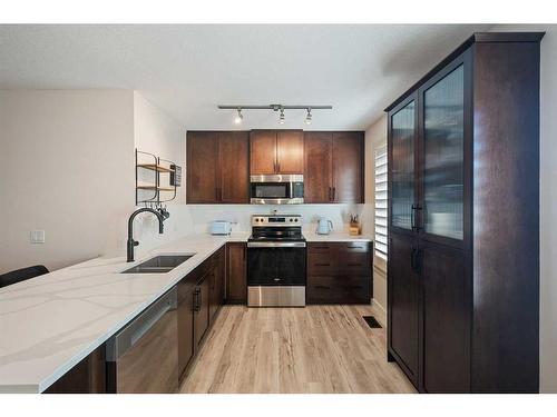 89 Aspen Hills Terrace Sw, Calgary, AB - Indoor Photo Showing Kitchen With Double Sink