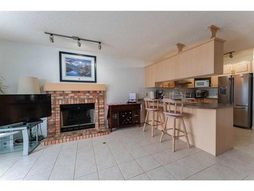 6416 Sierra Morena Boulevard Sw, Calgary, AB - Indoor Photo Showing Other Room With Fireplace