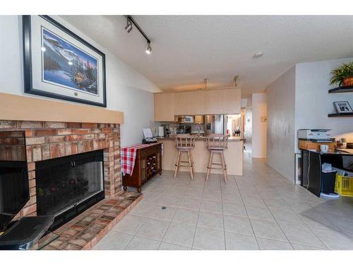 6416 Sierra Morena Boulevard Sw, Calgary, AB - Indoor Photo Showing Living Room With Fireplace