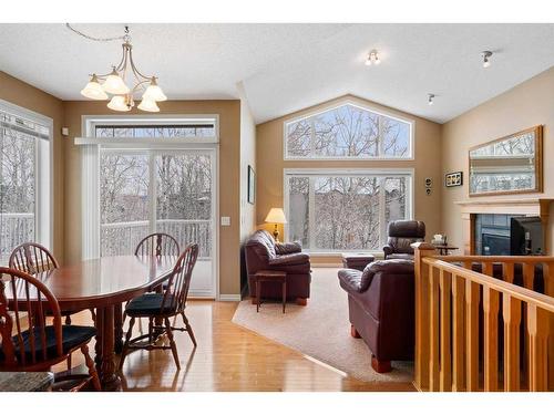 42 Wentworth Landing Sw, Calgary, AB - Indoor Photo Showing Dining Room With Fireplace