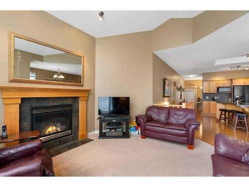 42 Wentworth Landing Sw, Calgary, AB - Indoor Photo Showing Living Room With Fireplace