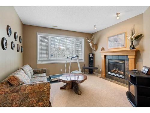 42 Wentworth Landing Sw, Calgary, AB - Indoor Photo Showing Living Room With Fireplace