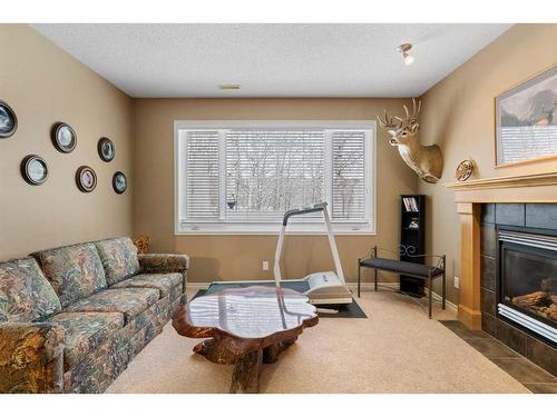 42 Wentworth Landing Sw, Calgary, AB - Indoor Photo Showing Living Room With Fireplace