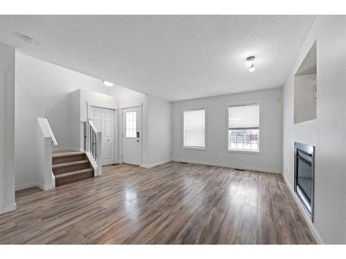 133 Covepark Crescent Ne, Calgary, AB - Indoor With Fireplace