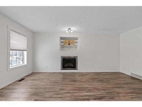 133 Covepark Crescent Ne, Calgary, AB - Indoor With Fireplace