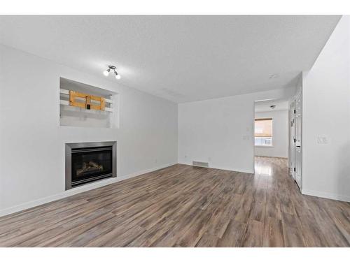 133 Covepark Crescent Ne, Calgary, AB - Indoor Photo Showing Living Room With Fireplace