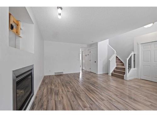 133 Covepark Crescent Ne, Calgary, AB - Indoor With Fireplace