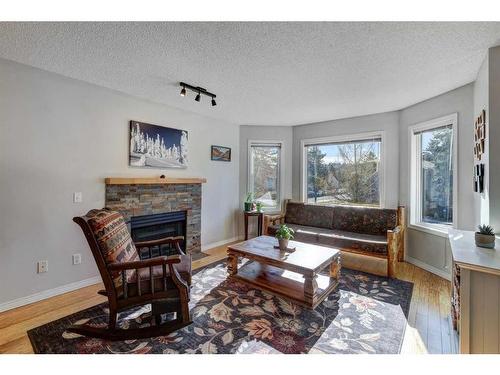 4604 Montgomery Avenue Nw, Calgary, AB - Indoor Photo Showing Living Room With Fireplace