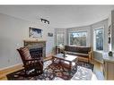 4604 Montgomery Avenue Nw, Calgary, AB  - Indoor Photo Showing Living Room With Fireplace 