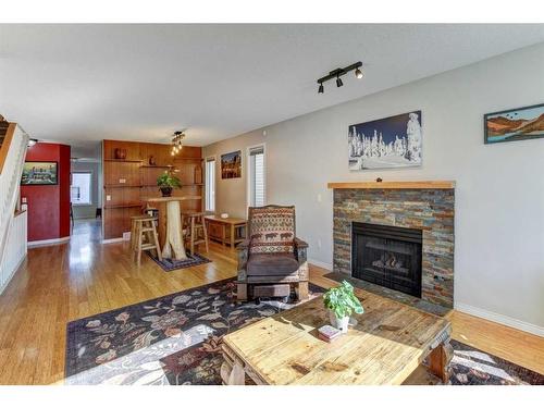 4604 Montgomery Avenue Nw, Calgary, AB - Indoor Photo Showing Living Room With Fireplace