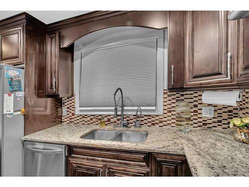 748 Rundleridge Drive Ne, Calgary, AB - Indoor Photo Showing Kitchen With Double Sink