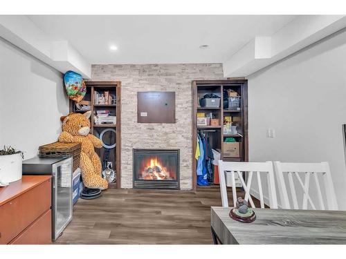 748 Rundleridge Drive Ne, Calgary, AB - Indoor Photo Showing Other Room With Fireplace