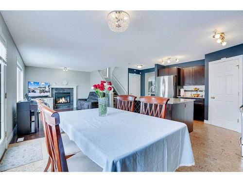 178 Citadel Estates Heights Nw, Calgary, AB - Indoor Photo Showing Dining Room With Fireplace