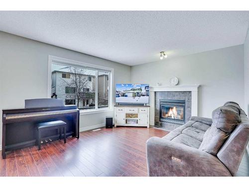 178 Citadel Estates Heights Nw, Calgary, AB - Indoor Photo Showing Living Room With Fireplace