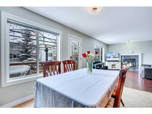 178 Citadel Estates Heights Nw, Calgary, AB - Indoor Photo Showing Dining Room With Fireplace