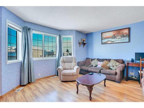 115 Coral Springs Circle Ne, Calgary, AB - Indoor Photo Showing Living Room