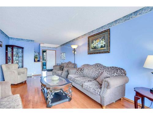 115 Coral Springs Circle Ne, Calgary, AB - Indoor Photo Showing Living Room