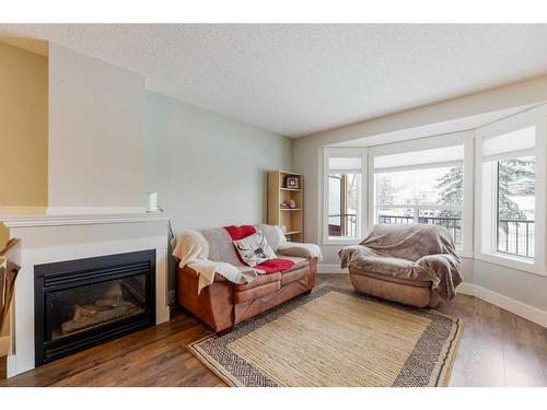 53 Hidden Valley Villas Nw, Calgary, AB - Indoor Photo Showing Living Room With Fireplace