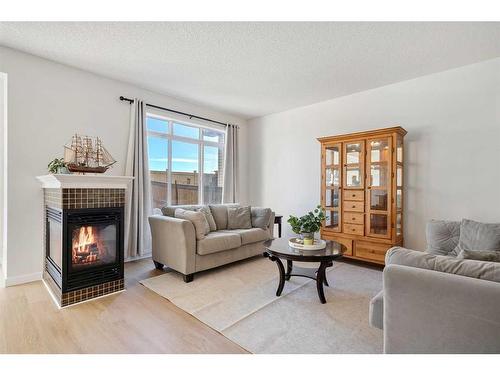 519 Auburn Bay Heights Se, Calgary, AB - Indoor Photo Showing Living Room With Fireplace