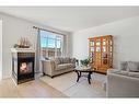 519 Auburn Bay Heights Se, Calgary, AB  - Indoor Photo Showing Living Room With Fireplace 