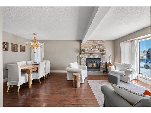 59 Rivercrest Crescent Se, Calgary, AB - Indoor Photo Showing Living Room With Fireplace