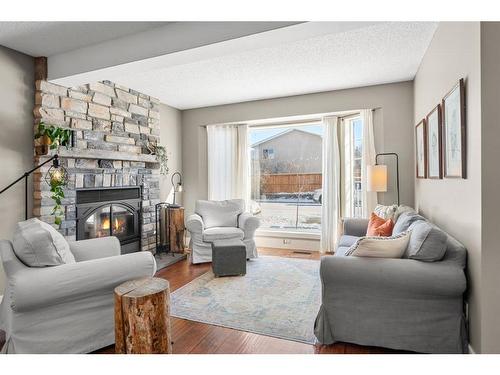 59 Rivercrest Crescent Se, Calgary, AB - Indoor Photo Showing Living Room With Fireplace