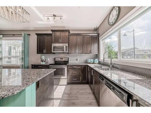 9 Legacy Glen Row Se, Calgary, AB - Indoor Photo Showing Kitchen With Stainless Steel Kitchen With Upgraded Kitchen