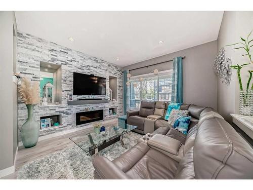 9 Legacy Glen Row Se, Calgary, AB - Indoor Photo Showing Living Room With Fireplace