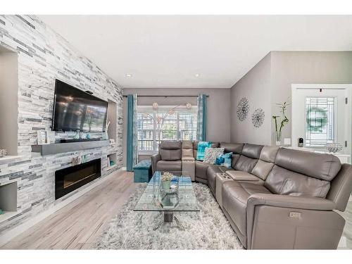 9 Legacy Glen Row Se, Calgary, AB - Indoor Photo Showing Living Room With Fireplace