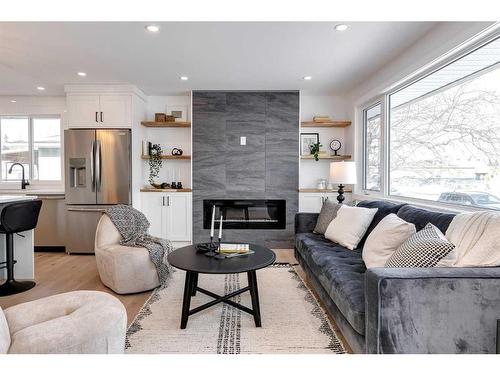 185 Westminster Drive Sw, Calgary, AB - Indoor Photo Showing Living Room With Fireplace