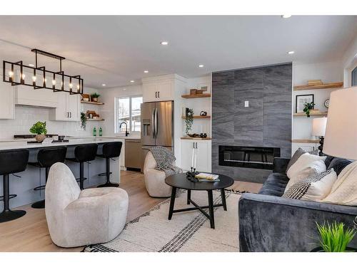 185 Westminster Drive Sw, Calgary, AB - Indoor Photo Showing Living Room With Fireplace