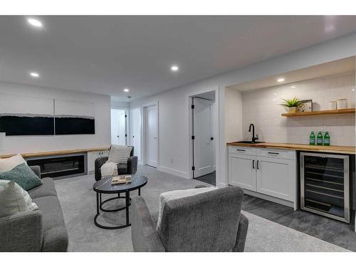 185 Westminster Drive Sw, Calgary, AB - Indoor Photo Showing Living Room With Fireplace