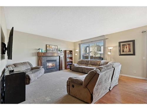 83 Copperstone Boulevard Se, Calgary, AB - Indoor Photo Showing Living Room With Fireplace