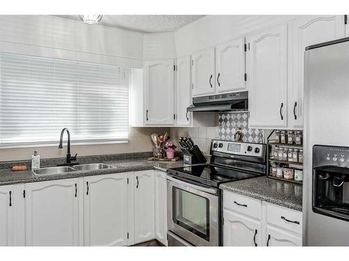 28 Beddington Crescent Ne, Calgary, AB - Indoor Photo Showing Kitchen With Double Sink