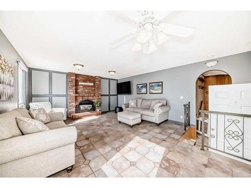 5031 Marian Road Ne, Calgary, AB - Indoor Photo Showing Living Room With Fireplace