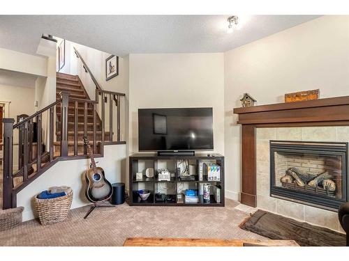 274 Cranleigh Place Se, Calgary, AB - Indoor Photo Showing Living Room With Fireplace