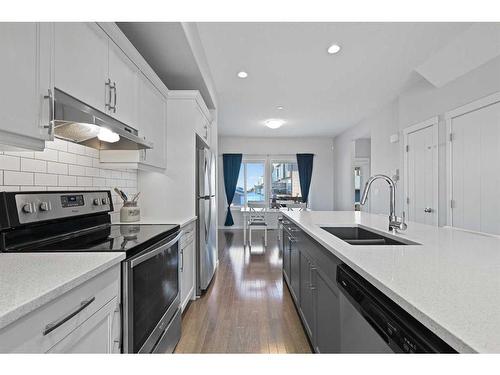 16 Howse Drive Ne, Calgary, AB - Indoor Photo Showing Kitchen With Double Sink With Upgraded Kitchen