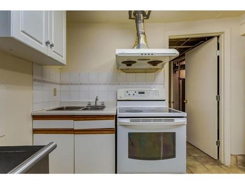 6119 Thornaby Way Nw, Calgary, AB - Indoor Photo Showing Kitchen With Double Sink