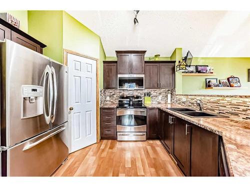 311 Mt Aberdeen Close Se, Calgary, AB - Indoor Photo Showing Kitchen With Double Sink With Upgraded Kitchen