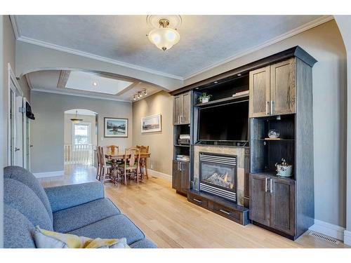 2105 Westmount Road Nw, Calgary, AB - Indoor Photo Showing Living Room With Fireplace