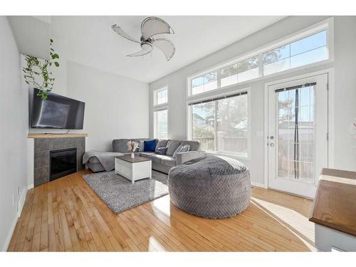 27 Copperfield Court Se, Calgary, AB - Indoor Photo Showing Living Room With Fireplace