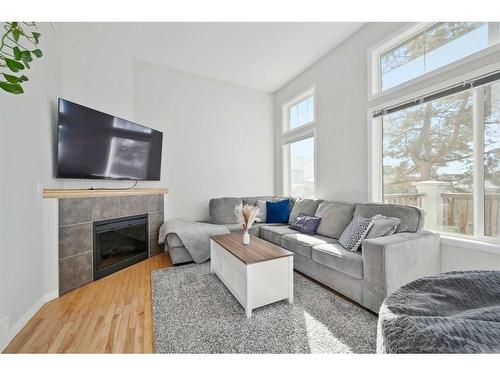 27 Copperfield Court Se, Calgary, AB - Indoor Photo Showing Living Room With Fireplace