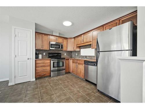 27 Copperfield Court Se, Calgary, AB - Indoor Photo Showing Kitchen