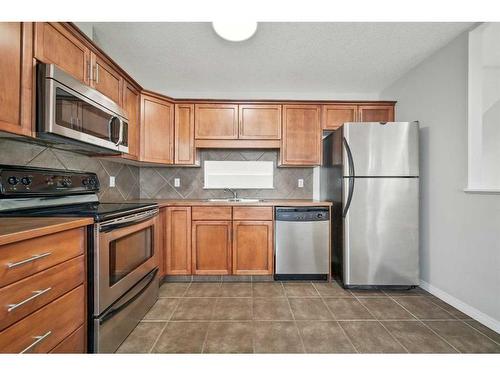 27 Copperfield Court Se, Calgary, AB - Indoor Photo Showing Kitchen With Double Sink