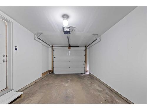 153 Everhollow Heights Sw, Calgary, AB - Indoor Photo Showing Garage