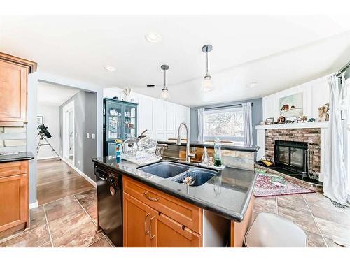 28 Hawkfield Place Nw, Calgary, AB - Indoor Photo Showing Kitchen With Fireplace With Double Sink