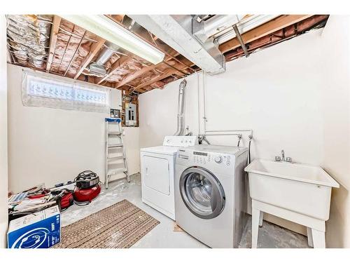 83 Ranchridge Way Nw, Calgary, AB - Indoor Photo Showing Laundry Room