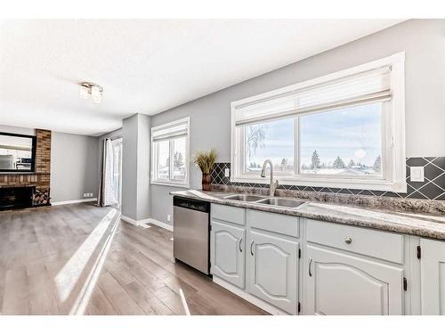 83 Ranchridge Way Nw, Calgary, AB - Indoor Photo Showing Kitchen With Double Sink